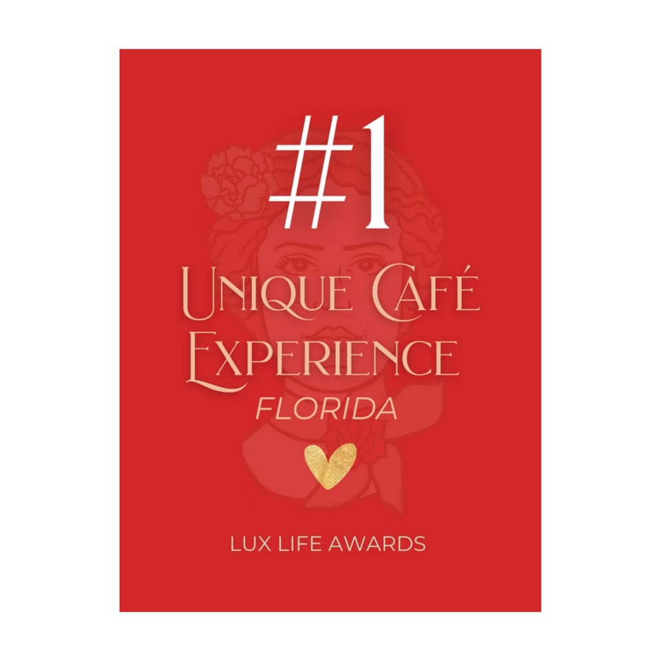 Red graphic with "#1 Unique Café Experience Florida" and "Lux Life Awards" in gold and white text.
